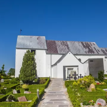 View of a path leading to the historic church in Jelling, Denmark.