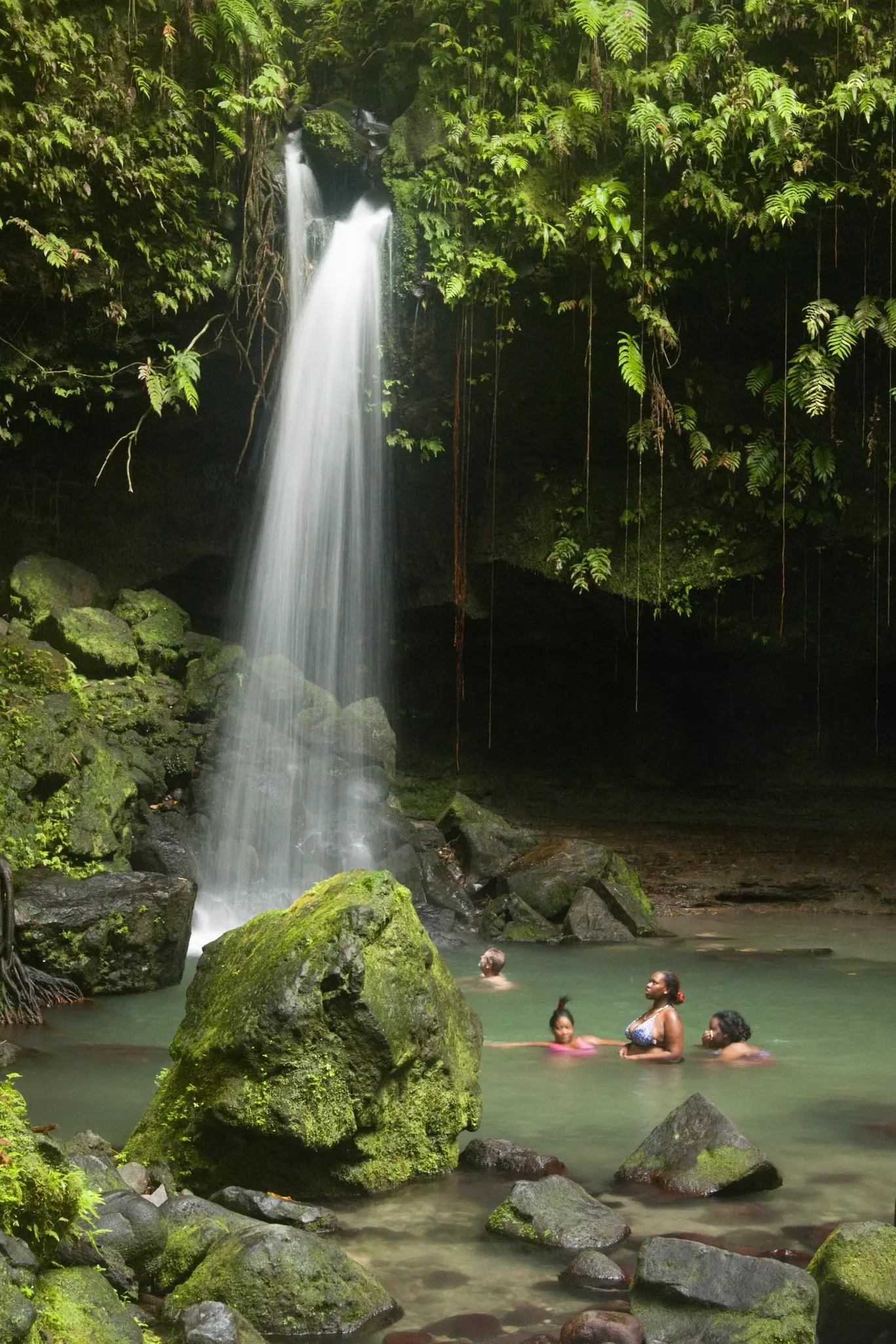 Emerald Pool's 20-foot waterfall makes it a perfect place to enjoy a refreshing dip in the cool waters Alicia Johnson/Lonely Planet