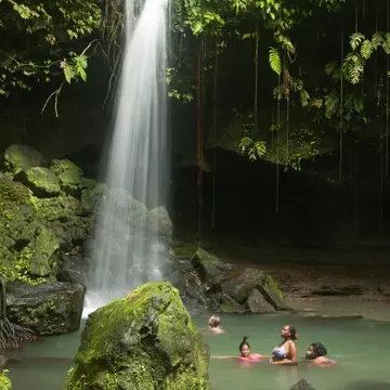 Emerald Pool's 20-foot waterfall makes it a perfect place to enjoy a refreshing dip in the cool waters Alicia Johnson/Lonely Planet