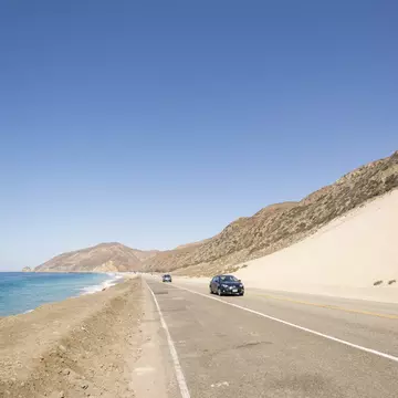 USA, Malibu, cars on Pacific Coast Highway
707454189
car, car driving, no people, Mobility, on the move, Travel, road traffic, mountain, blue sky, coast, beach, outdoor, aerial view, day, Travel destination, side line, coastal road, pacific coast highway, copy space, clear sky, sea, nature, Lane, USA, California, Malibu, transportation, vehicle, motor vehicle, driving, traffic, sky, landscape, elevated view, birds eye view, road, road marking, water, Photography, Color Image