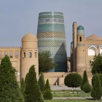 Kalta Minor minaret and city walls in Khiva, Uzbekistan, Central Asia