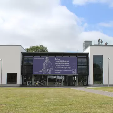 Exterior view of the experience centre at the Jelling Monuments, (Kongernes Jelling), in Jutland. A popular viking tourist attraction and historic site.