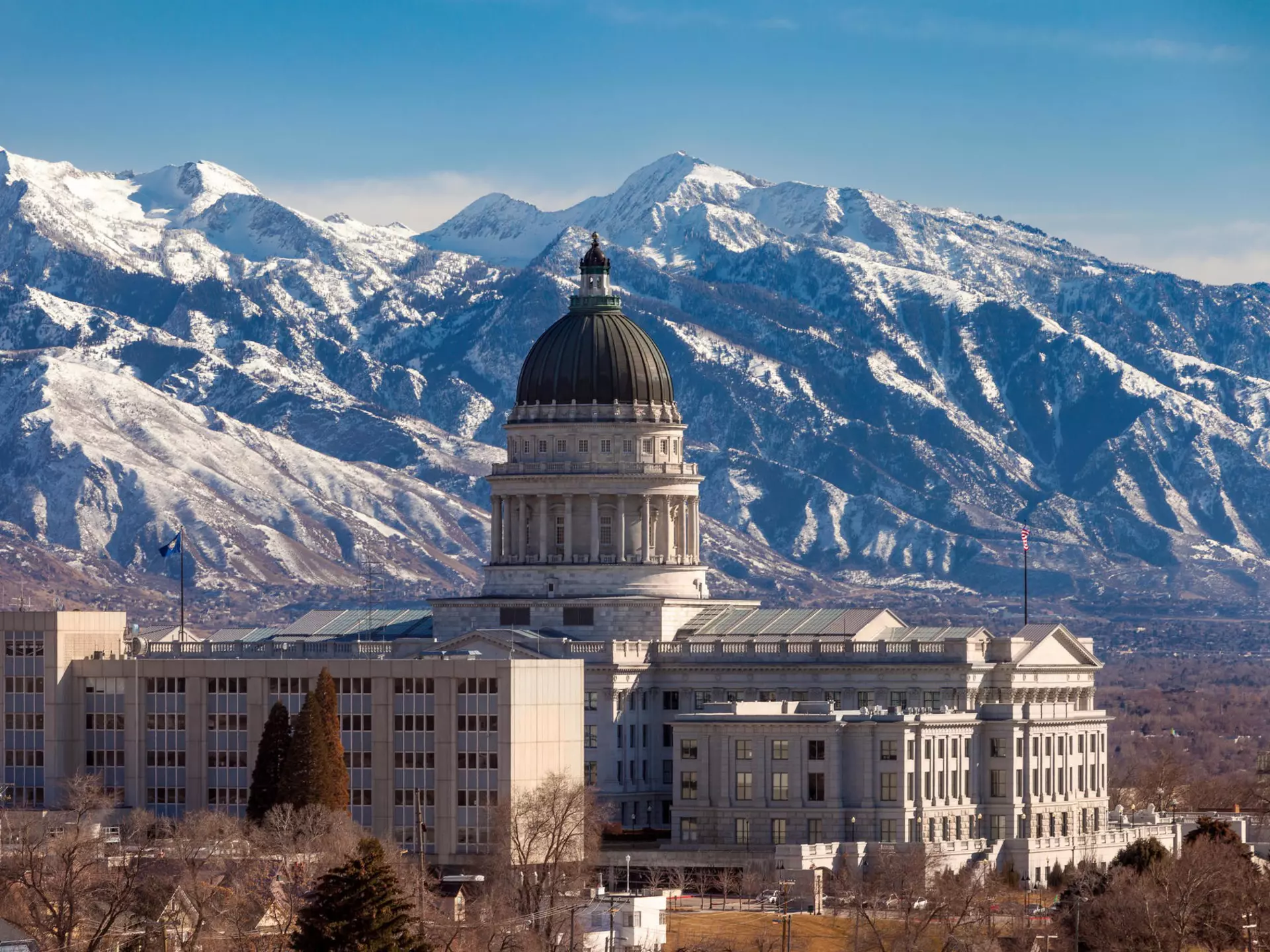 Utah State Capitol Building and the mountains of the Wasatch Range beyond, Salt Lake City, Utah, USA