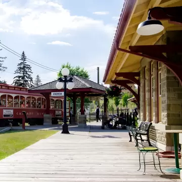  Vintage red streetcar at the Andrew station platform in Heritage Park Historical Village, Calgary, Alberta, Canada.