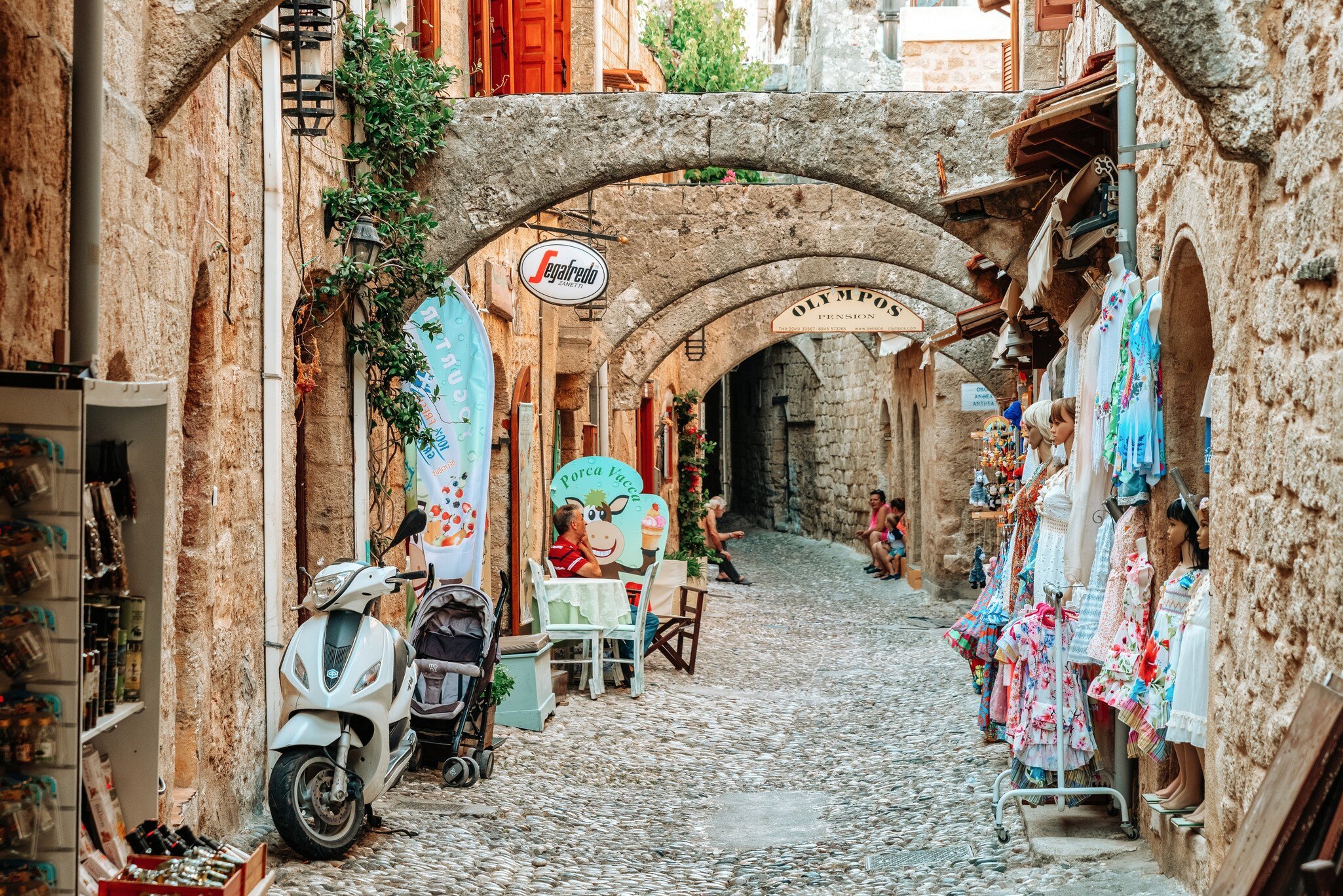 RHODES, GREECE - JULY 4, 2022: Street of the old town with shops in Turkish quarter inRhodes city in Greece; Shutterstock ID 2189036733;