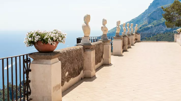 A view of Villa Cimbrone Gardens + Infinity Terrace with the sea beyond, Ravello, Italy. July 2025.
