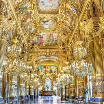 The Grand Foyer of the Palais Garnier (Garnier Palace), also known as L'Opéra Garnier (Garnier Opera House), in Paris, France on a summer day.