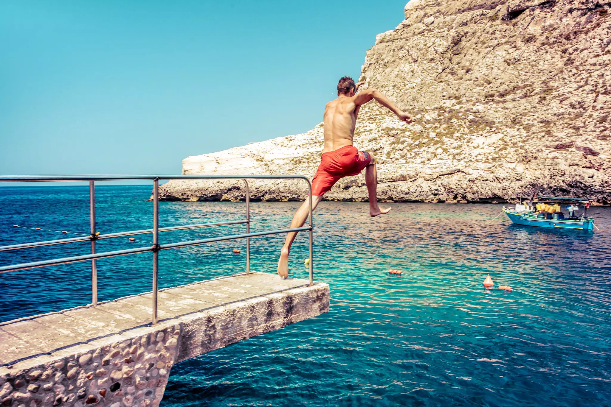 Take your cues from locals about where and when to enter the water at Malta’s countless swimming spots. Jaroslav Moravcik/Shutterstock