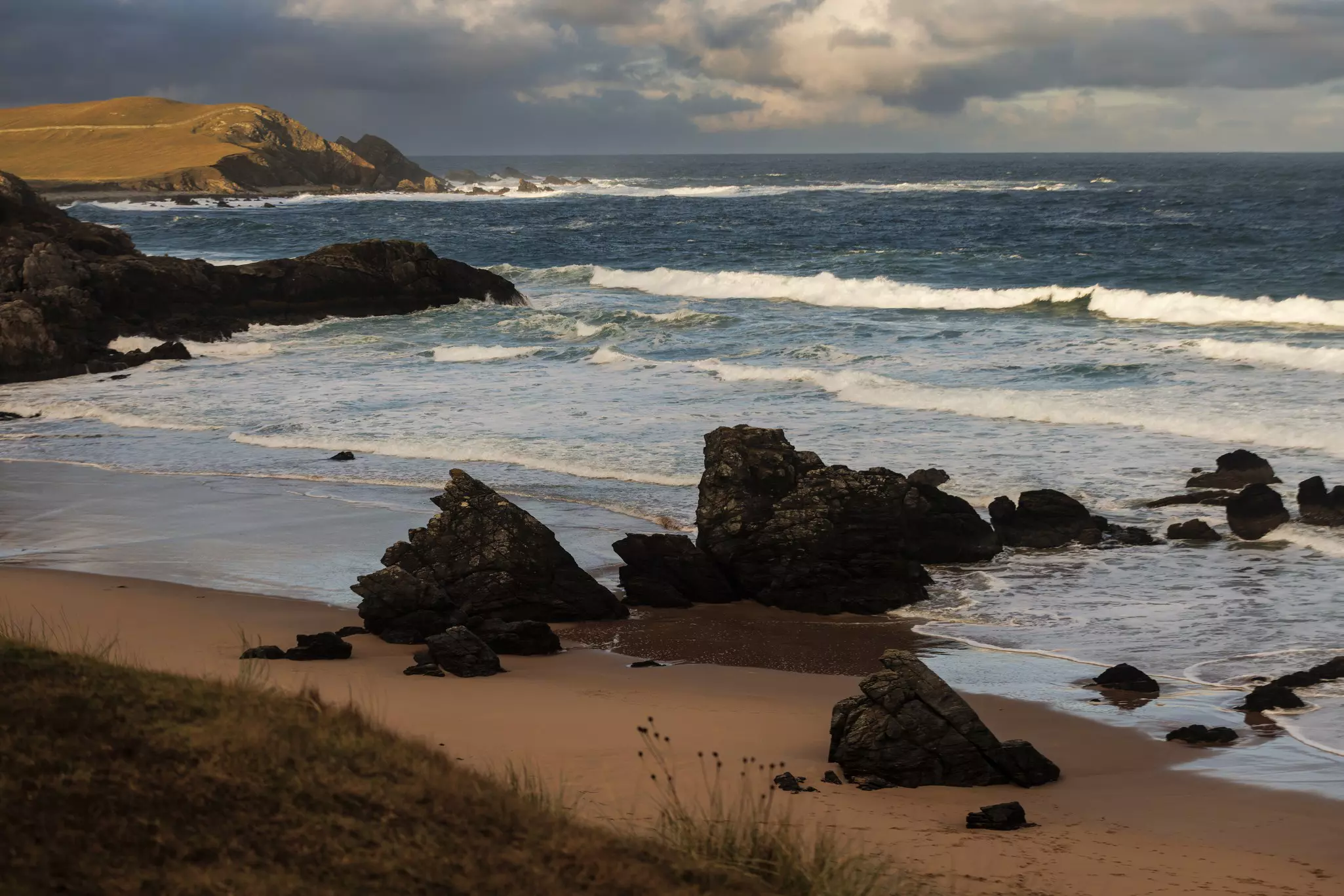 Waves break on Durness Beach on the north coast of Scotland.
