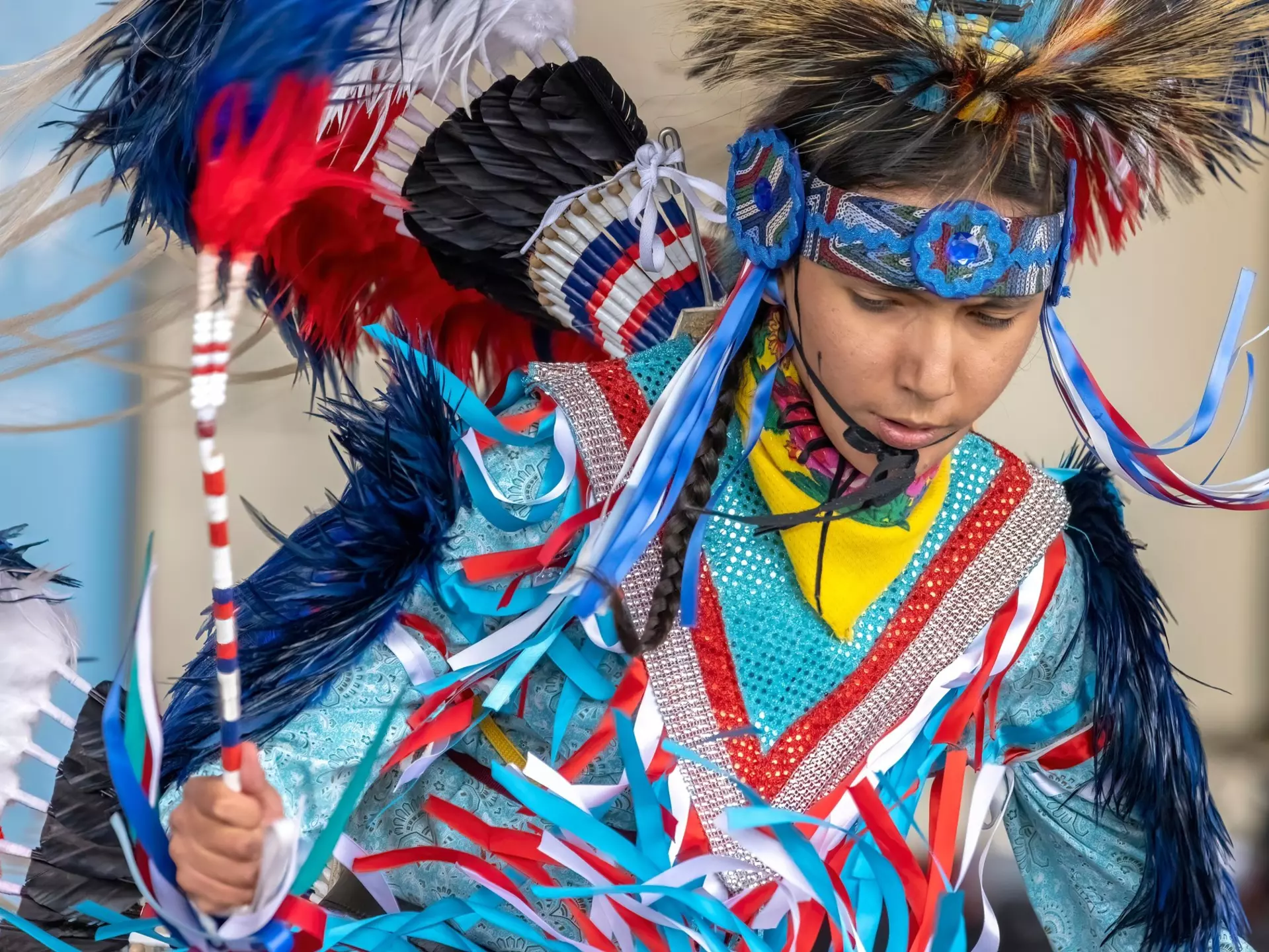 A young Indigenous boy in vivid traditional dress, Alberta, Canada