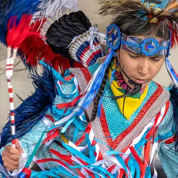 A young Indigenous boy in vivid traditional dress, Alberta, Canada