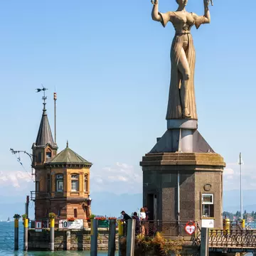 Constance, Germany - July 30, 2019: Old lighthouse and statue of Imperia in harbor of Konstanz. Sculpture is tourist attraction of city. Scenery of Constance Lake (Bodensee) and landmarks in summer., License Type: media, Download Time: 2025-11-14T02:13:45.000Z, User: katherineeloisemarsh73, Editorial: true, purchase_order: 56530 - Guidebooks, job: Global Publishing- WIP, client: Munich Bavaria & the Black Forest 9, other: Kat Marsh