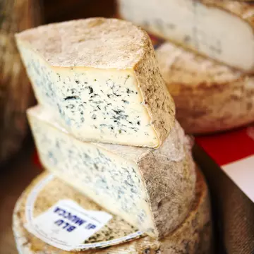 Cheese for sale at market in Langhe Valley.