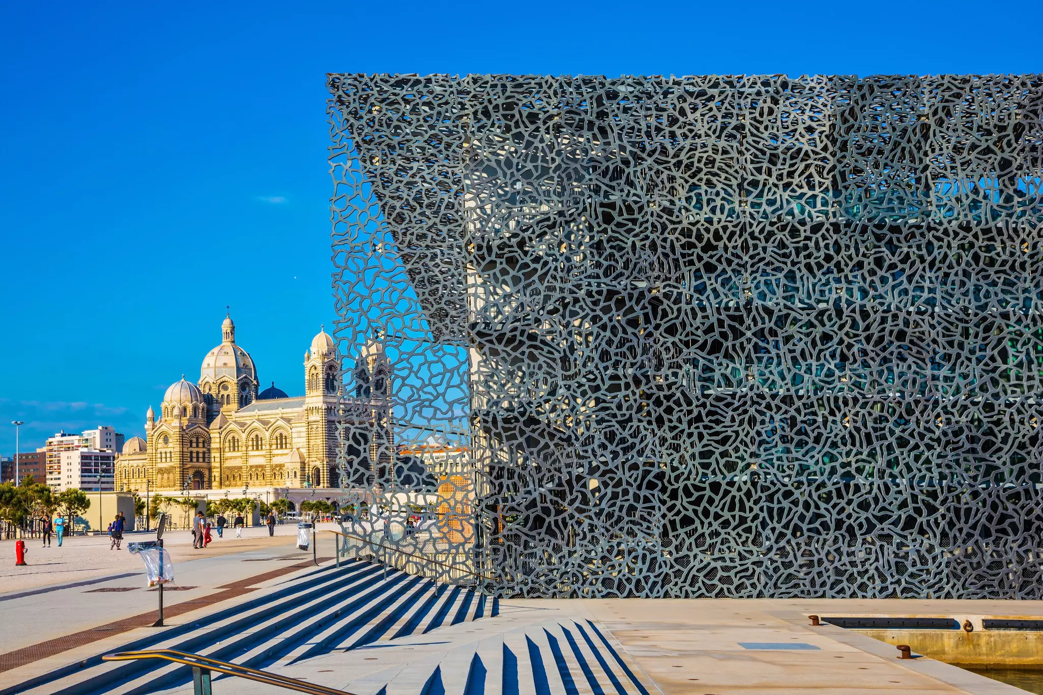 The old Cathedral and a modern building on the waterfront of Marseille.