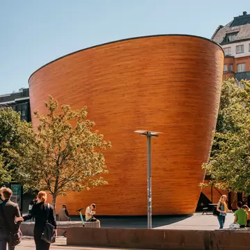 Helsinki, Finland - June 30, 2019: The Kamppi Chapel, also known as the Chapel of Silence, is a chapel in Kamppi, Helsinki.  License Type: media  Download Time: 2023-03-16T19:26:00.000Z  User: Norma.PrauseBrewer_LonelyPlanet  Is Editorial: Yes  purchase_order:   