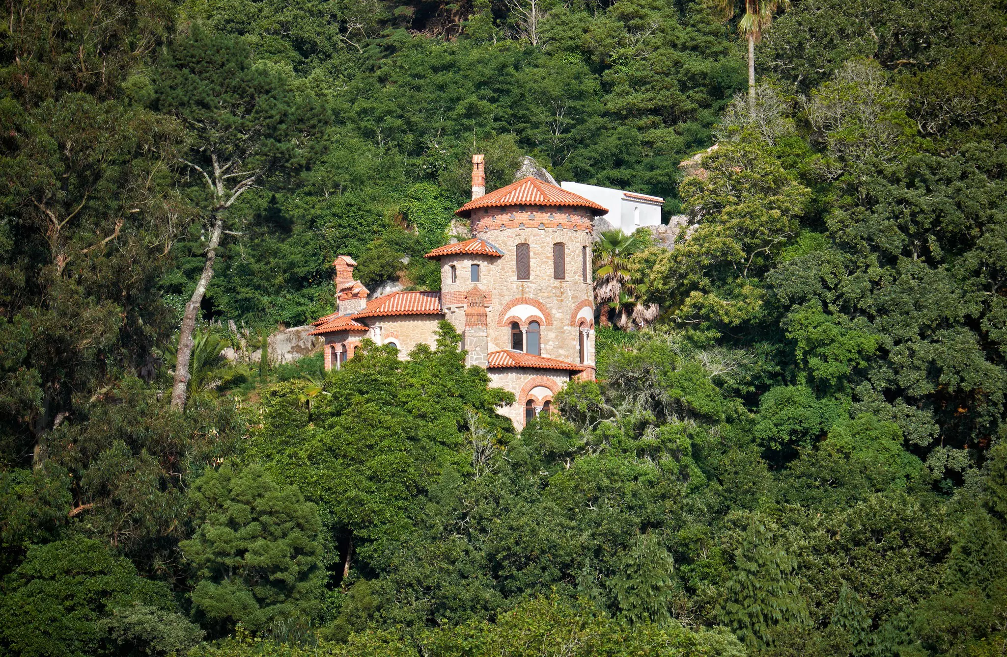 The romantic view of Villa Sassetti hidden in the rich vegetation of wooded hills. Sintra, Portugal., License Type: media, Download Time: 2025-11-11T16:12:25.000Z, User: LP_YKhanna, Editorial: false, purchase_order: 65050 - Digital Destinations and Articles, job: LP, client: App Content, other: Yuvraj Khanna