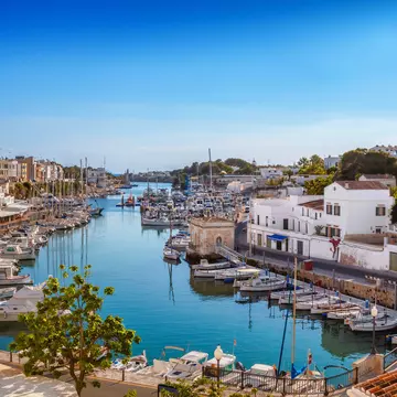 View of the Ciutadella Harbor on a sunny day on the island of Menorca in Spain.