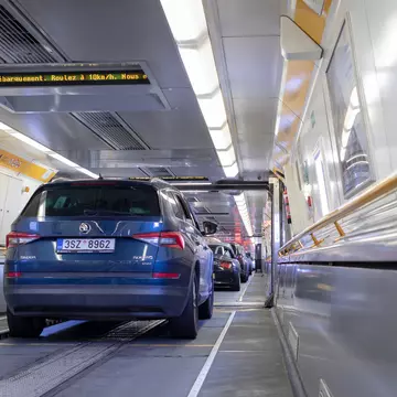 Cars lined up bumper to bumper inside a Eurotunnel train