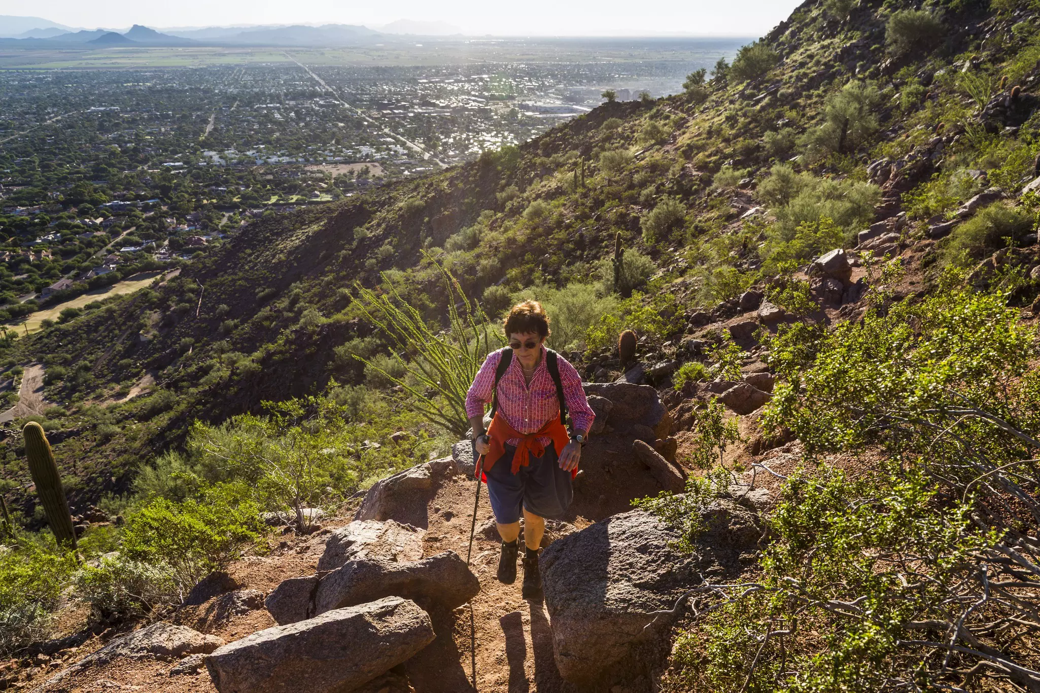 A hiker on the Cholla Trail on Camelback Mountain in Phoenix, Arizona.