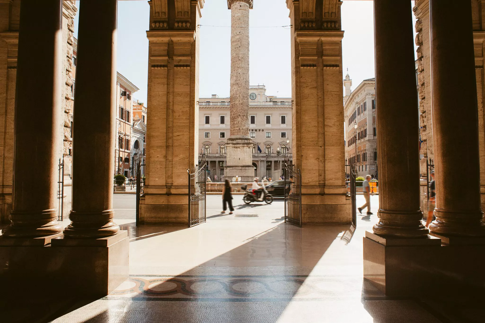 The monument of Trajan's Column seen through architectural columns
