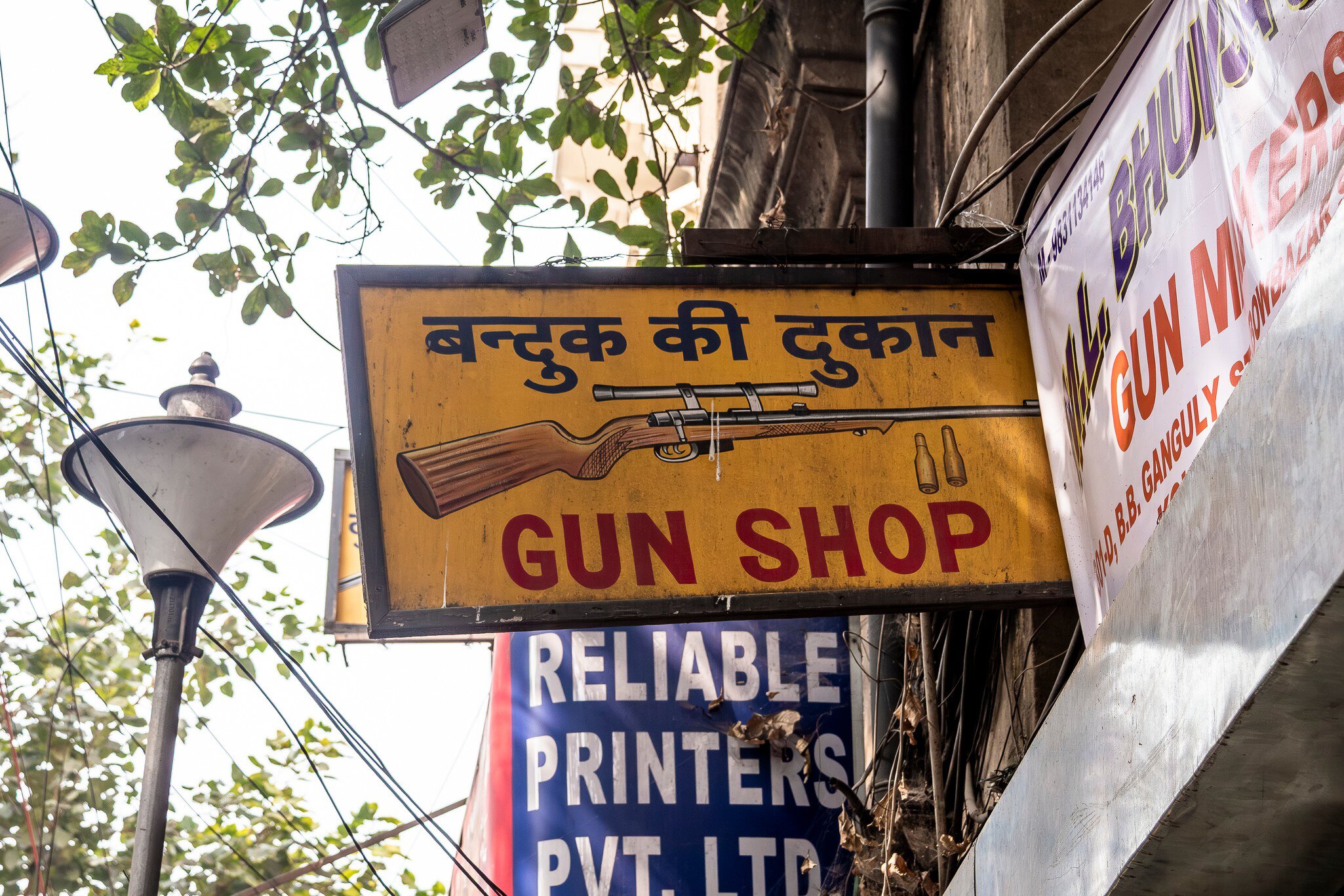 Sign of the M.L. Bhunja gun shop in Kolkata, india.