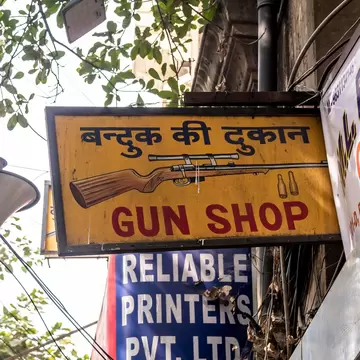 Sign of the M.L. Bhunja gun shop in Kolkata, india.
