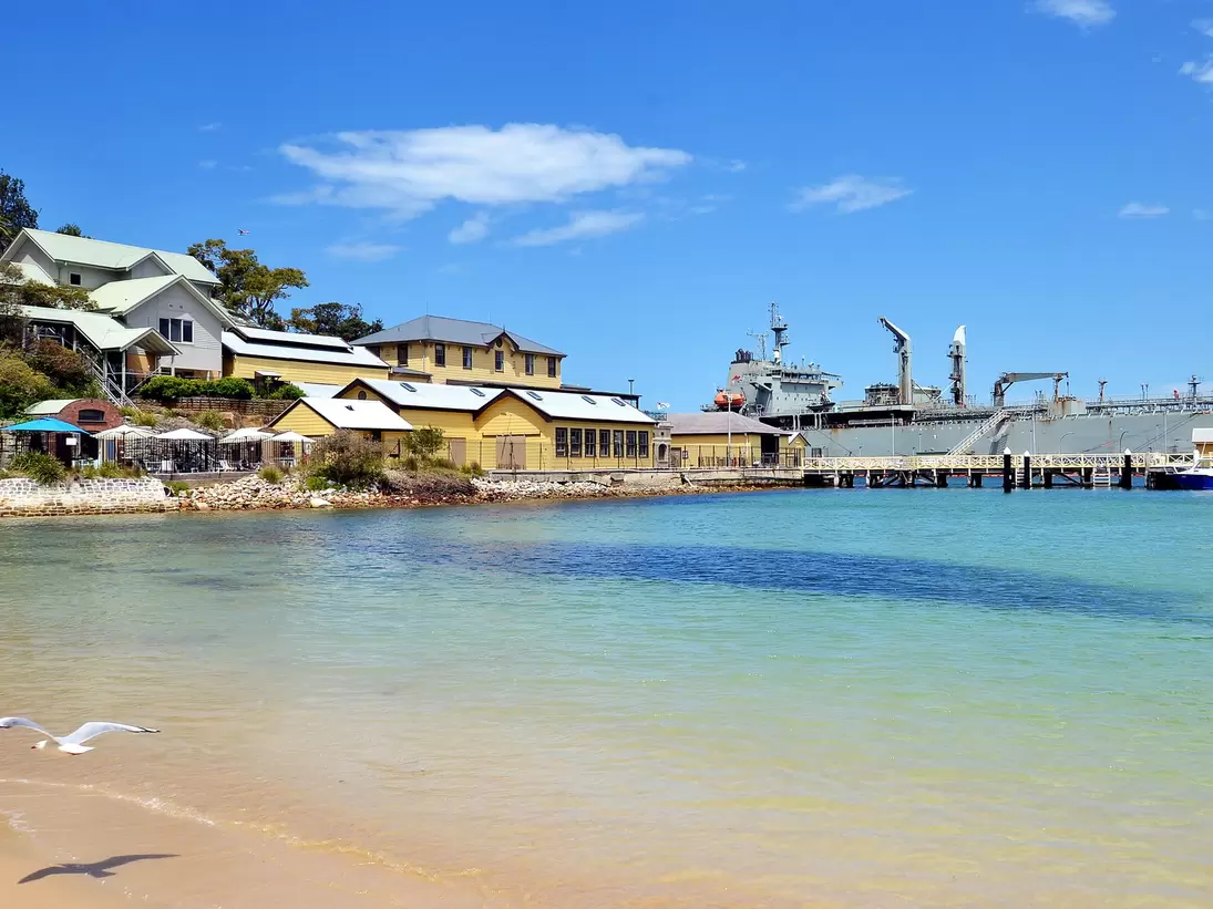 View on Chowder Bay beach and military ship in Sydney Harbour National Park, Australia.