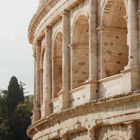 The arched exterior of the Roman Colosseum. 