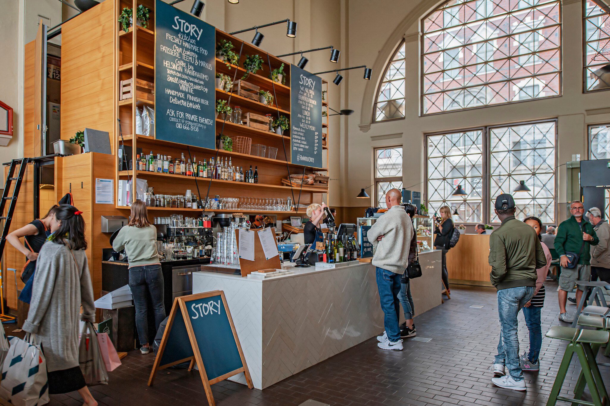 View of Story Cafe Bar inside the Old Market Hall Vanha Kauppahalli in Harbor Area of Helsinki, Finland in June 2019, License Type: media, Download Time: 2025-02-05T16:03:51.000Z, User: Norma.PrauseBrewer_LonelyPlanet, Editorial: true, purchase_order: 56530 - Guidebooks, job: Global publishing WIP, client: Pocket Helsinki 2, other: Norma Brewer