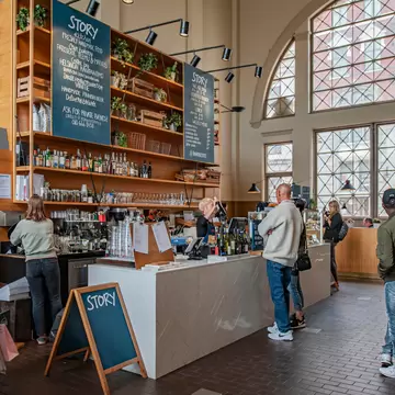 View of Story Cafe Bar inside the Old Market Hall Vanha Kauppahalli in Harbor Area of Helsinki, Finland in June 2019, License Type: media, Download Time: 2025-02-05T16:03:51.000Z, User: Norma.PrauseBrewer_LonelyPlanet, Editorial: true, purchase_order: 56530 - Guidebooks, job: Global publishing WIP, client: Pocket Helsinki 2, other: Norma Brewer