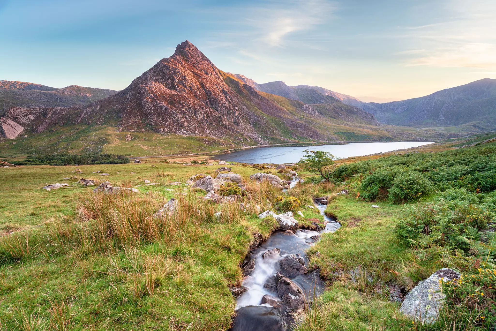 A view over meadows to Mount Tryfan in Snowdonia, Wales.
