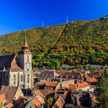 Brasov and its most important landmark, the Black Church towers over the old town. Transylvania, Romania.