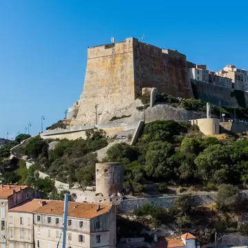 View of the Bastion de l'Étendard in the fortress of Bonifacio in the south of the island of Corsica in France. Medieval citadel built on a rocky promontory overlooking the Mediterranean Sea.