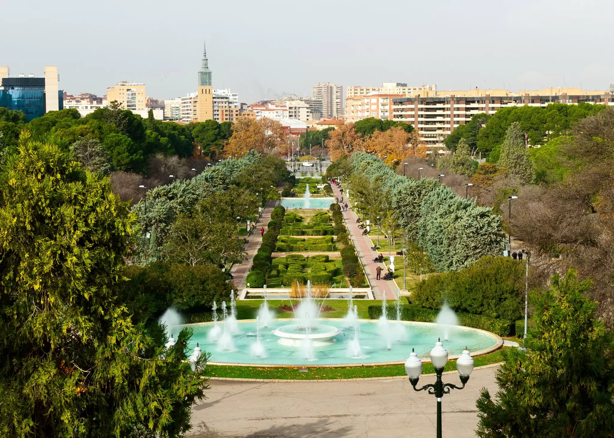 The central fountains at José Antonio Labordeta park in Zaragoza, Spain, with the city skyline behind.