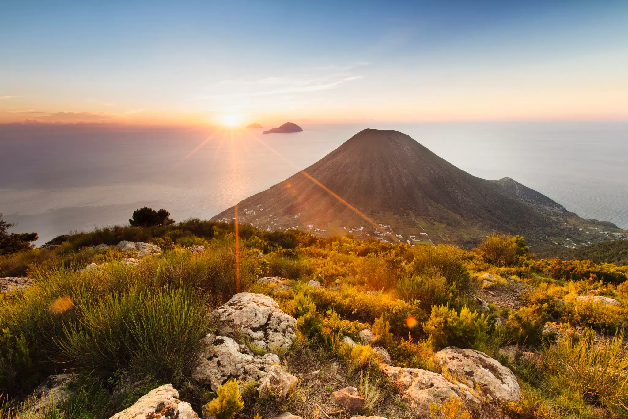 Sunset over Salina in Sicily's Aeolian archipelago. Adrienne Pitts/Lonely Planet