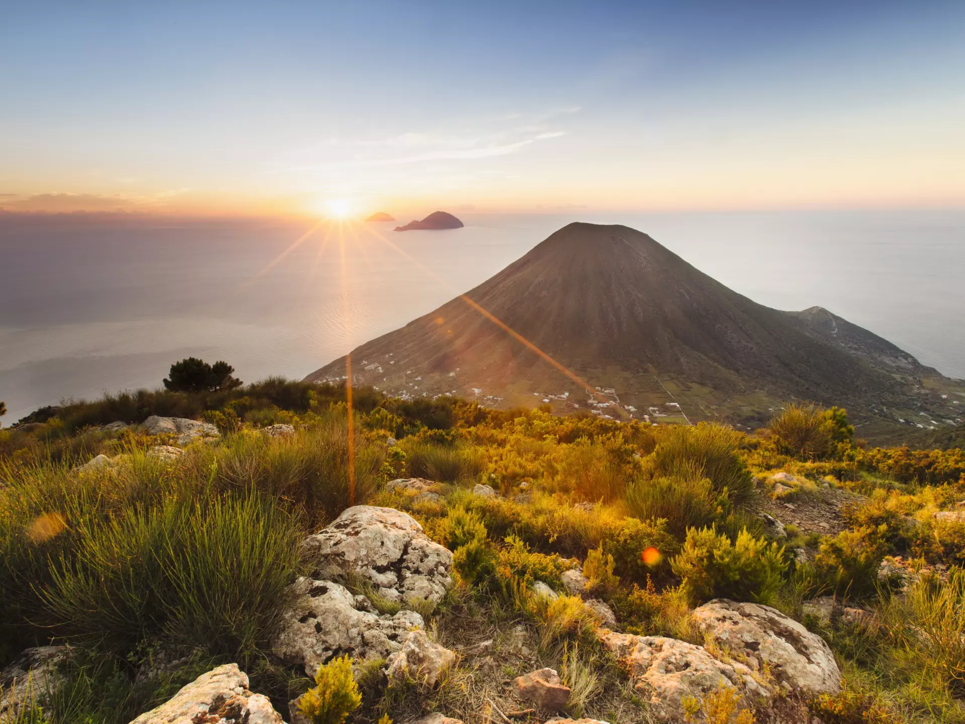 Sunset over Salina in Sicily's Aeolian archipelago. Adrienne Pitts/Lonely Planet