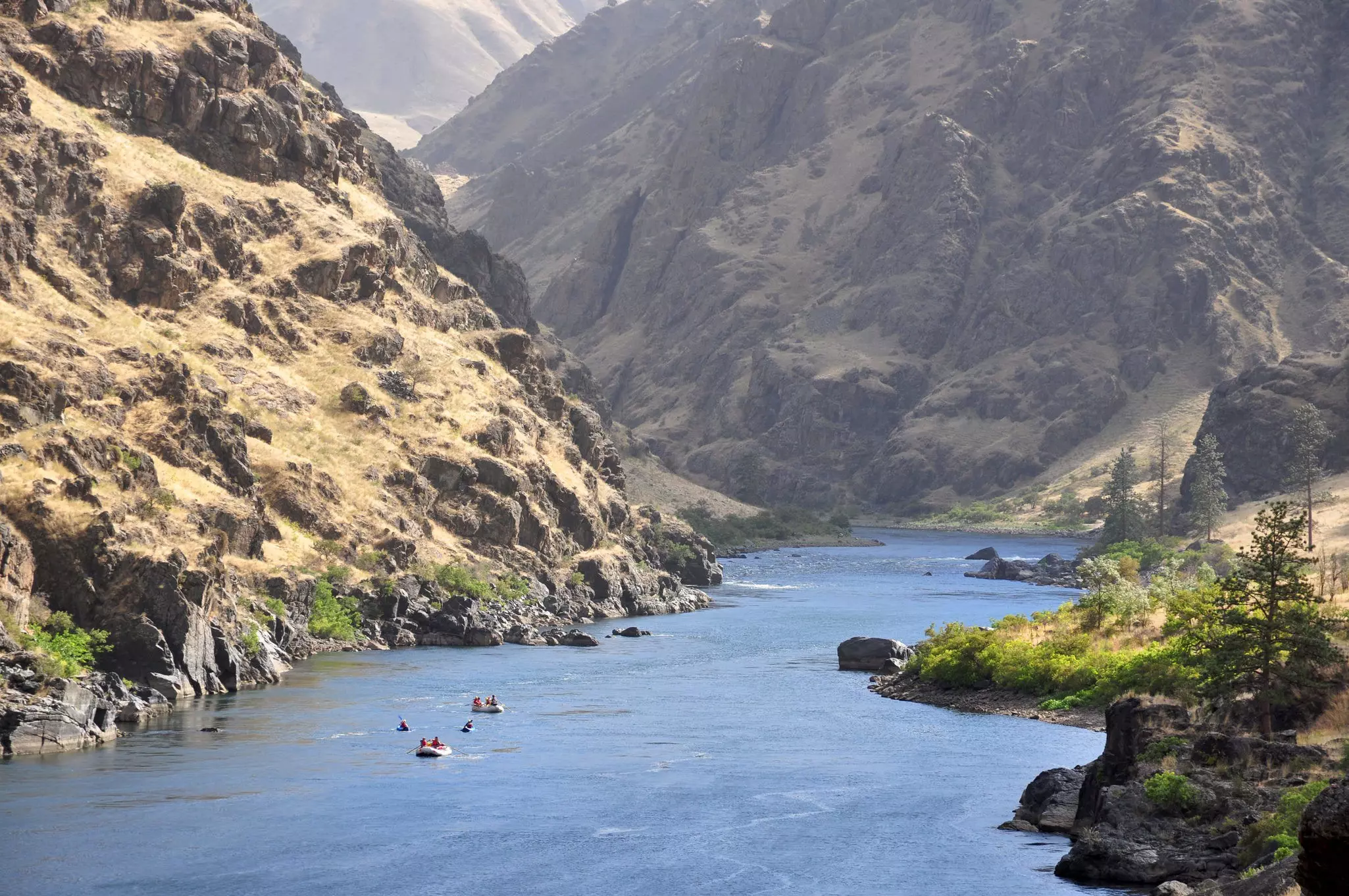 Rafts and kayaks descend the Snake River in Hells Canyon on the border between Idaho and Oregon.