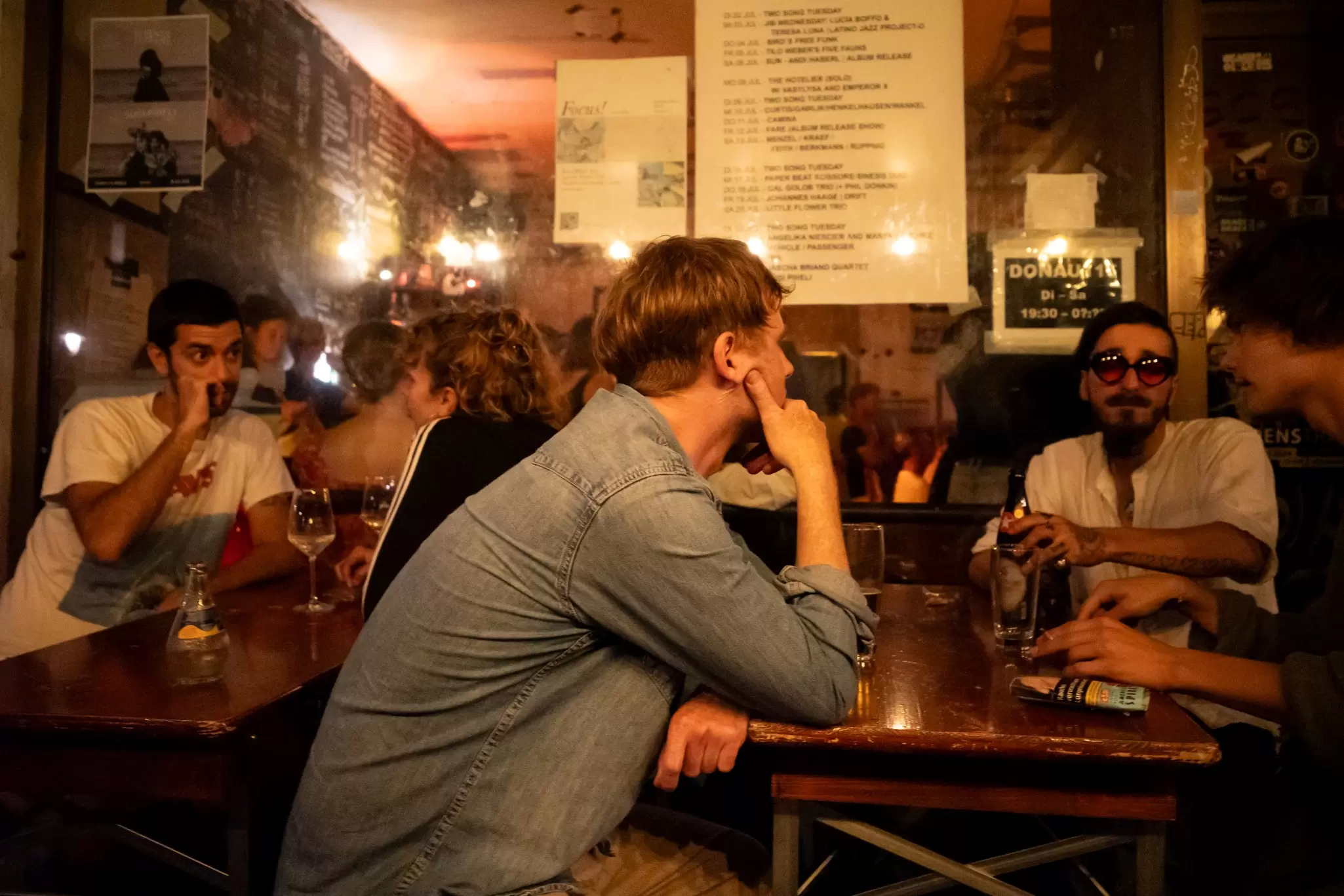 Patrons at Donau115, a bar and music venue in Neukölln, Berlin. Blake Horn for Lonely Planet
