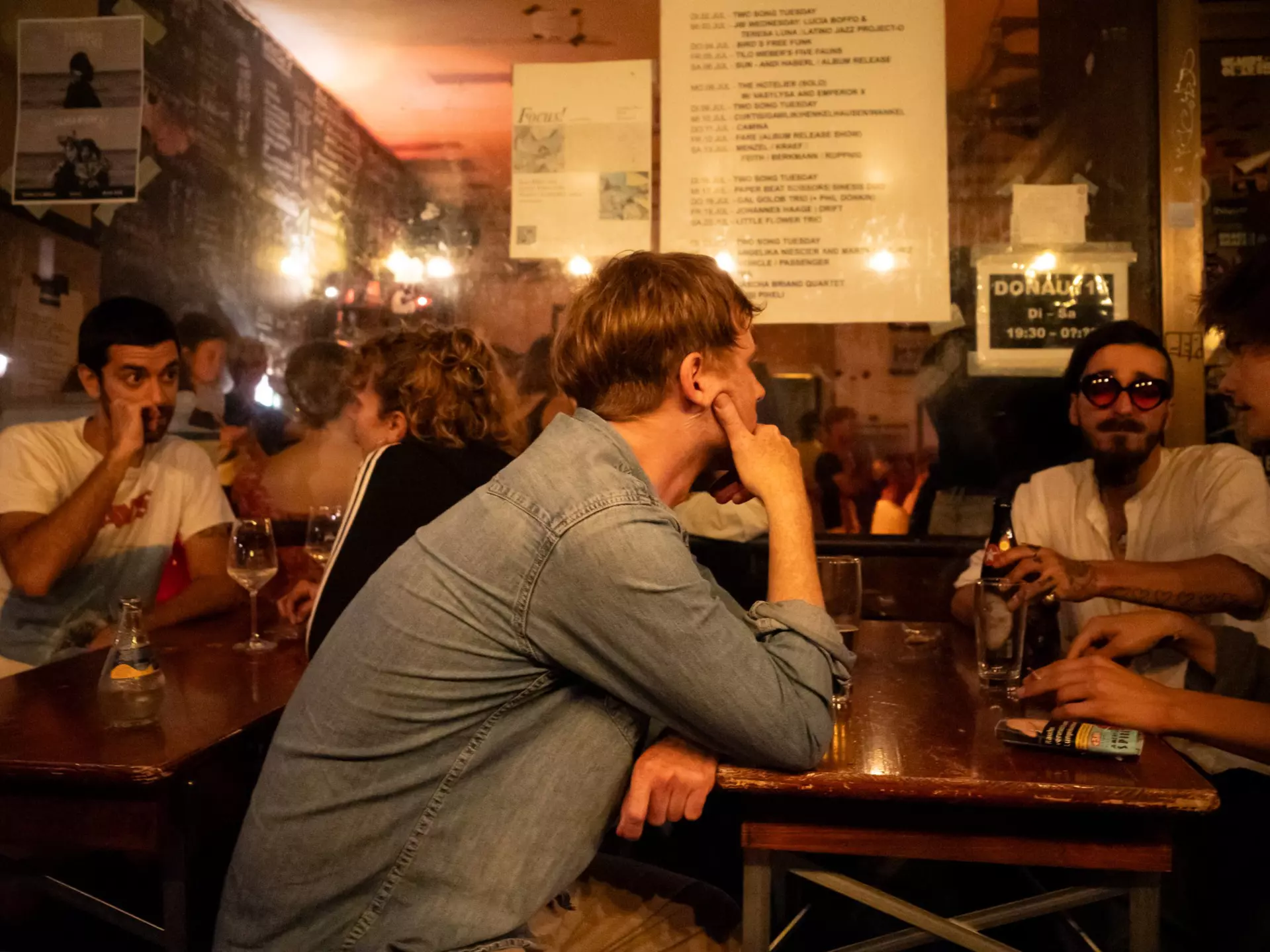 Patrons at Donau115, a bar and music venue in Neukölln, Berlin. Blake Horn for Lonely Planet
