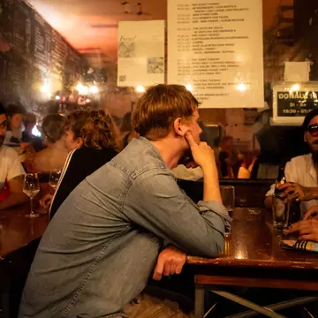 Patrons at Donau115, a bar and music venue in Neukölln, Berlin. Blake Horn for Lonely Planet