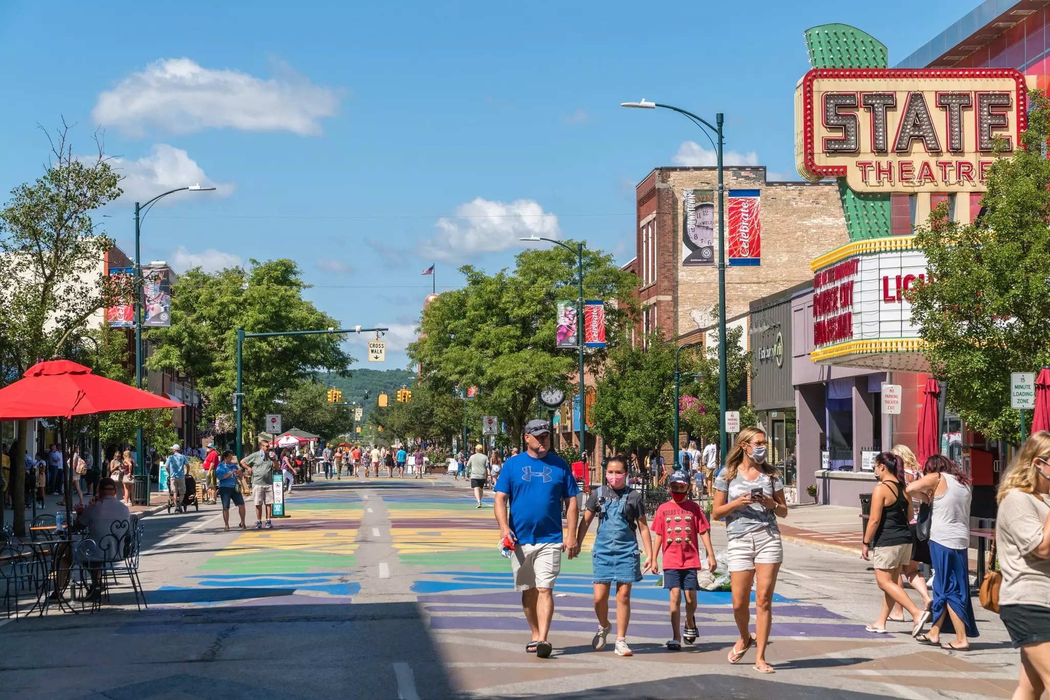 Busy Front Street in downtown with State Street Theater in Traverse City, Michigan