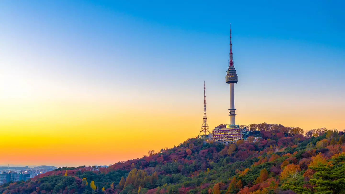 Sunset behind Namsan Mountain and the Namsan Seoul Tower during autumn.