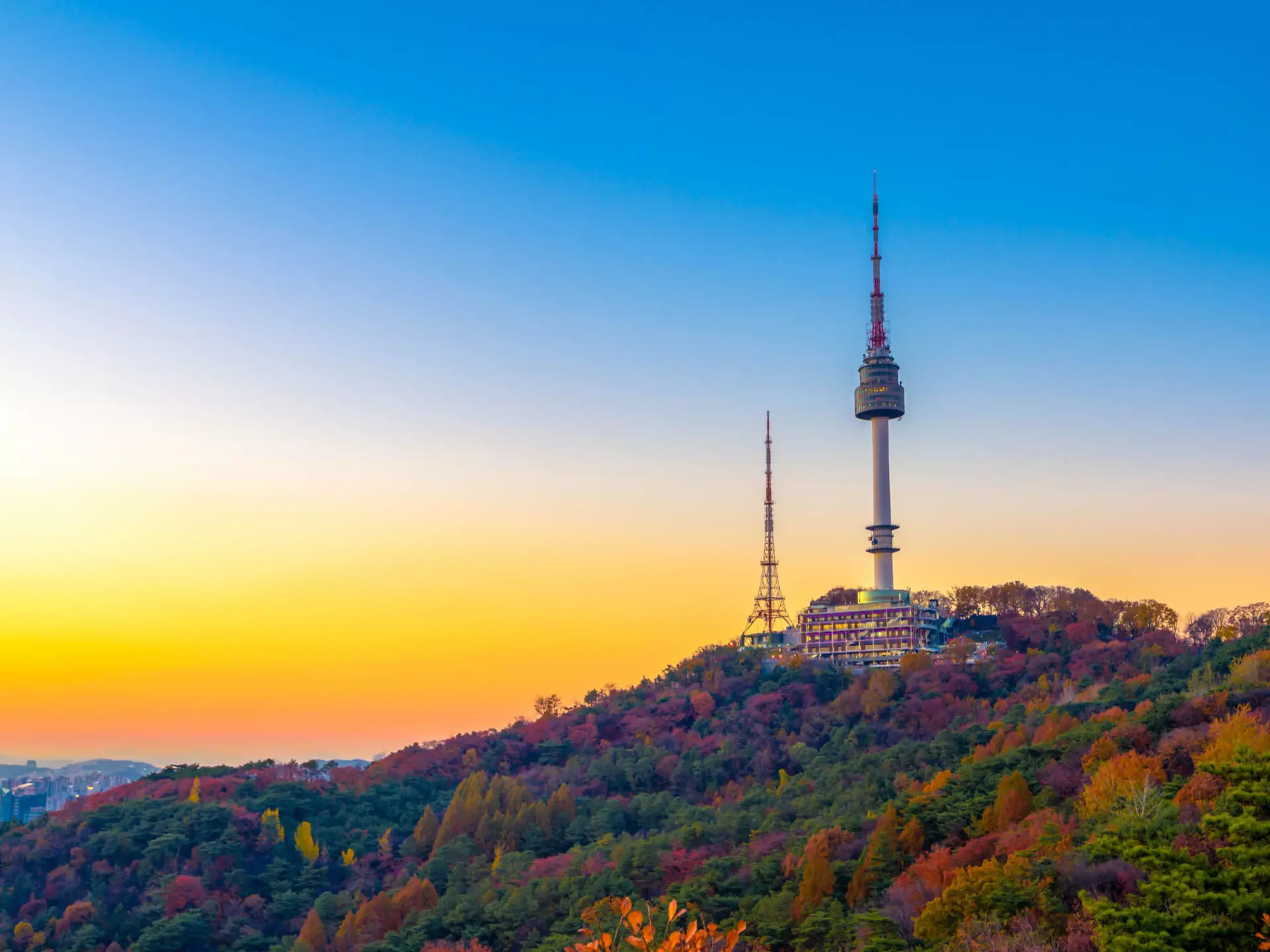 Sunset behind Namsan Mountain and the Namsan Seoul Tower during autumn.