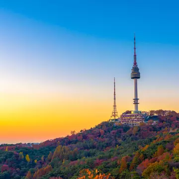 Sunset behind Namsan Mountain and the Namsan Seoul Tower during autumn.
