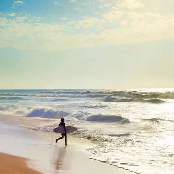 Unidentified surfer on the Atlantic coast of Swakopmund.