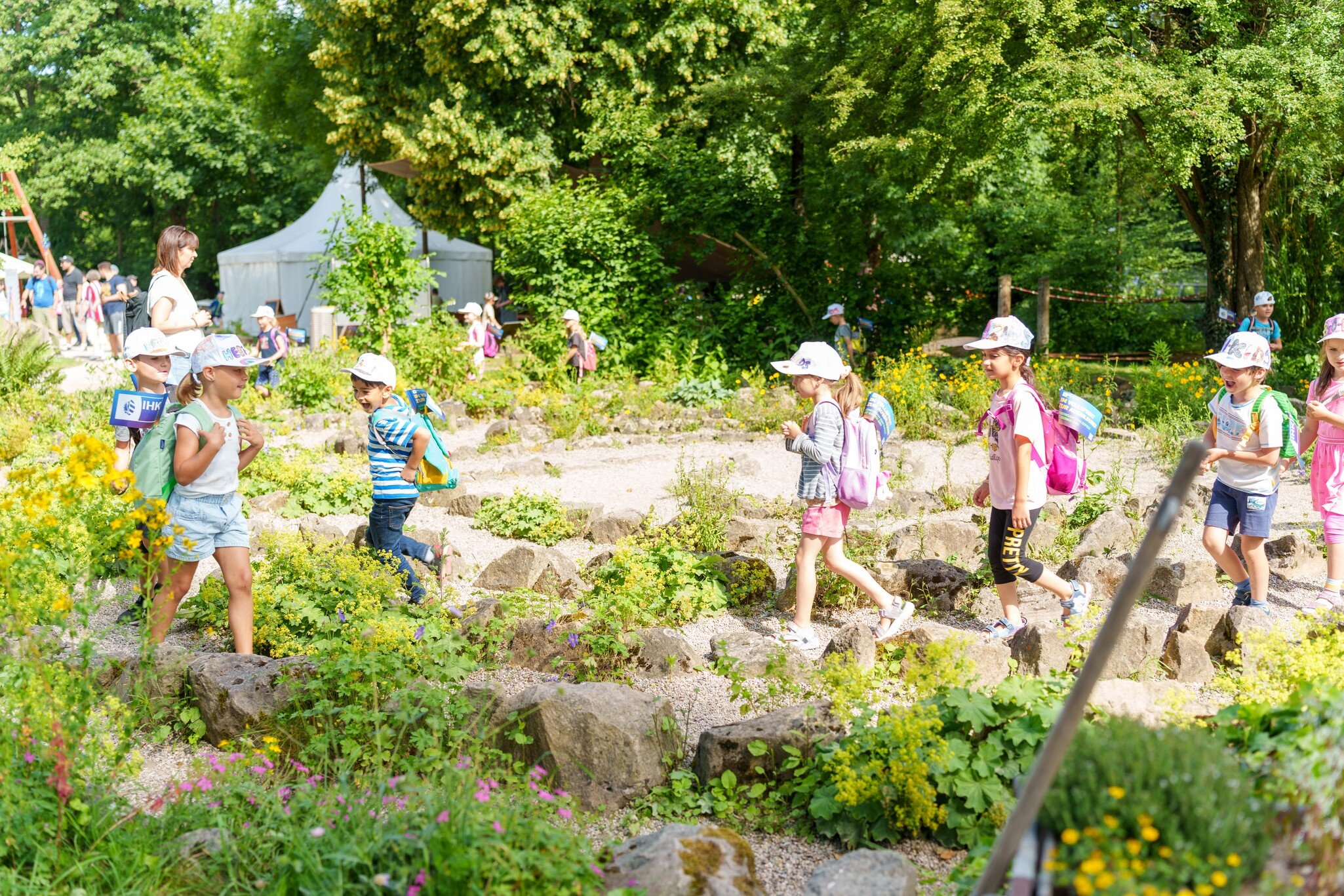 Children running at the Field of Experiences for the Senses in Nuremberg, Germany. 