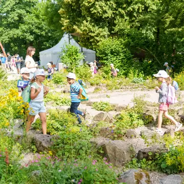 Children running at the Field of Experiences for the Senses in Nuremberg, Germany. 