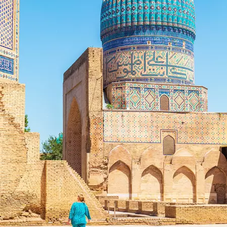 Woman in blue traditional dress in the courtyard of the Bibi-Khanum (Bibi-Khanym) mosque. Samarkand, Uzbekistan - June 20, 2024., License Type: media, Download Time: 2025-03-19T14:50:11.000Z, User: rhylton_redventures, Editorial: false, purchase_order: 65050 - Digital Destinations and Articles, job: Lonely Planet, client: Lonely Planet wip, other: Rhianydd Hylton