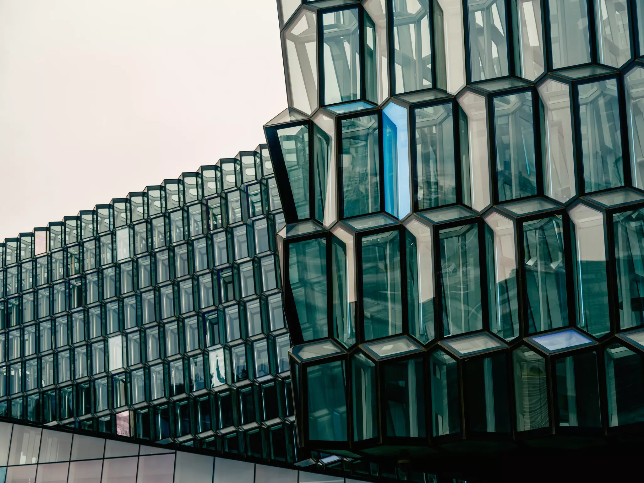 Protruding glass windows on a concert hall building.