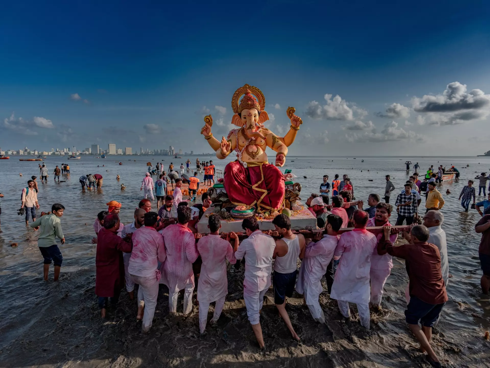 Celebrating Ganesh Chaturthi, Mumbai, India. Sandycinecam/Shutterstock